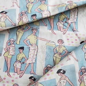 May include: A blue and white fabric with a repeating pattern of women wearing different outfits. The women are all wearing hats and carrying purses. The fabric has a polka dot pattern.