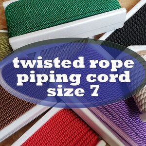 May include: Assortment of twisted rope piping cord in various colours, including green, brown, beige, red, purple, and black. The cord is size 7. The text "twisted rope piping cord size 7" is displayed on a blue oval.