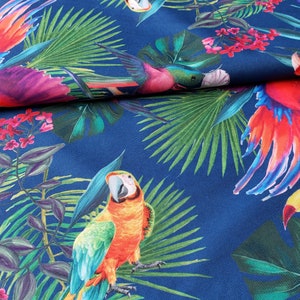May include: A blue fabric with a tropical print featuring parrots, toucans, and palm leaves. The parrots are red, orange, and green, and the toucans are yellow and black.