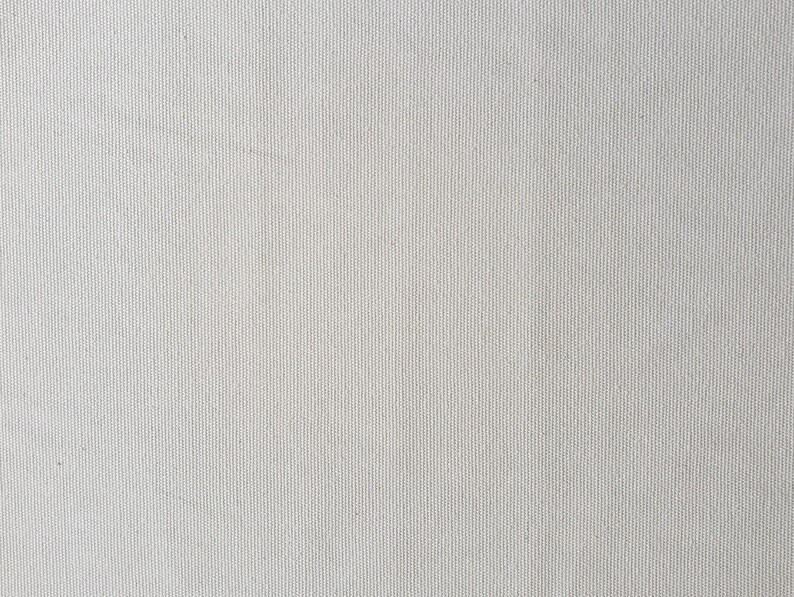 Puede incluir: Primer plano de una textura de lienzo blanco con un tejido fino.