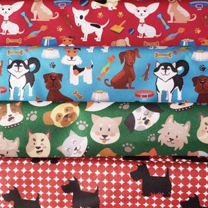 May include: Four fabric swatches featuring different dog patterns. The top swatch is red with white dogs, the second is blue with white and brown dogs, the third is green with brown and white dogs, and the bottom is red with black dogs.