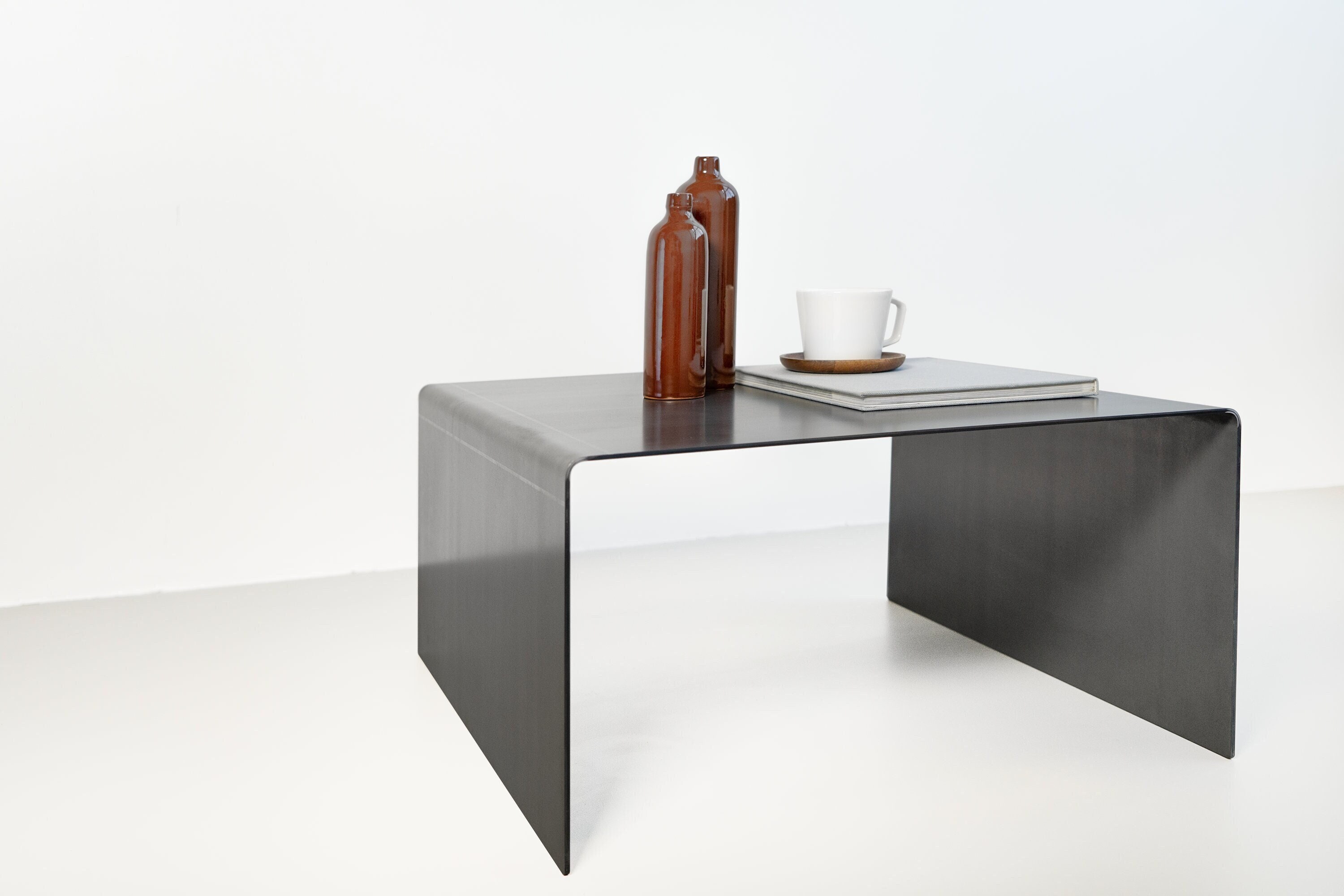Raw steel coffee table deals