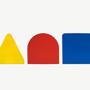 May include: Three geometric shapes in a row: a yellow triangle, a red semi-circle, and a blue square.