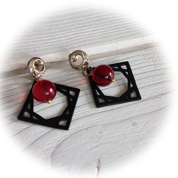 Earrings, black and red glass beads.