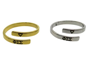 May include: Two gold and silver rings with a heart and the letters "ΦΣΣ" engraved on them.
