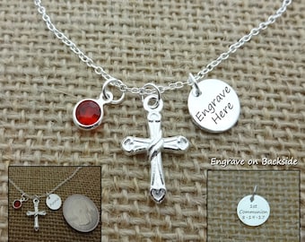 May include: Silver necklace with a cross charm, a red crystal charm, and a round charm that says "Engrave Here". The round charm has the words "Engrave on Backside" printed below it.