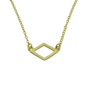 May include: A gold chain necklace with a simple, geometric diamond-shaped pendant.