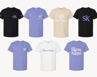 May include: A collection of seven short-sleeve crew neck t-shirts in black, light purple, beige, and white. Each shirt features various Sigma Kappa designs, including the letters SK, the Greek letters Sigma Kappa, and heart-shaped graphic accents.