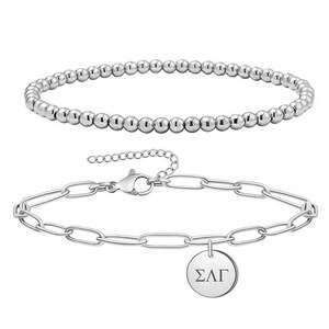 May include: Two silver bracelets. One is a beaded bracelet and the other is a chain bracelet with a charm that says "&Sigma;&Lambda;&Gamma;".