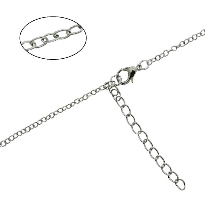 May include: Silver-colored necklace with a delicate chain and a lobster clasp closure. The necklace features an extender chain for adjustable length. A close-up shows the chain links.