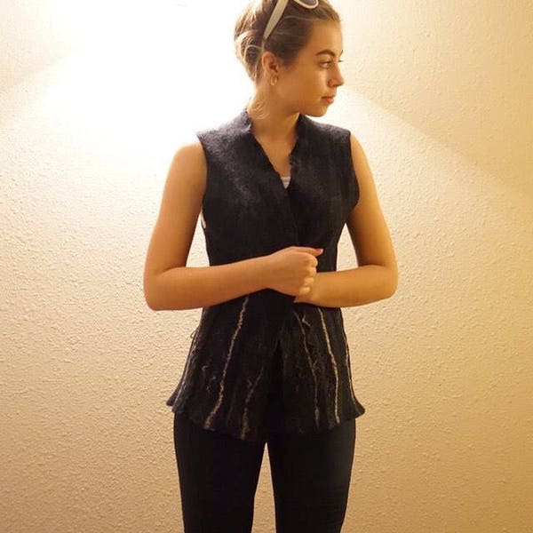 Black felted vest embellished with viscose, bamboo and hemp fiber.