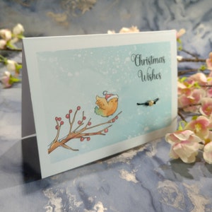 Tarjeta de deseos de Navidad con Christmas Robin. Tarjeta de felicitación con pulsera de deseos, tarjeta de feliz navidad, feliz navidad