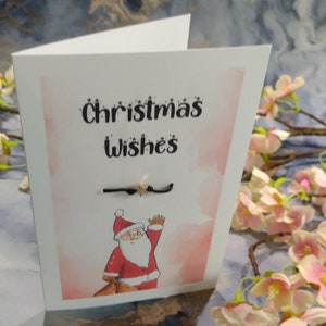Weihnachtskarte mit Weihnachtsmann. Grußkarte mit Wunscharmband, Frohe Weihnachten, Frohe Weihnachten