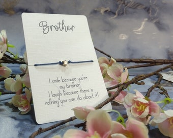 May include: A blue string bracelet with a gold star charm and a card that reads "Brother I smile because you're my brother. I laugh because there is nothing you can do about it!"