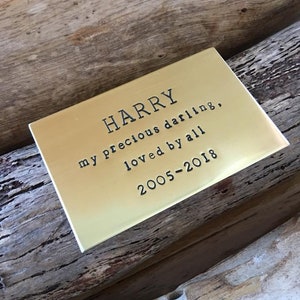 May include: A gold-coloured metal plaque with the inscription "HARRY my precious darling, loved by all 2005-2018".