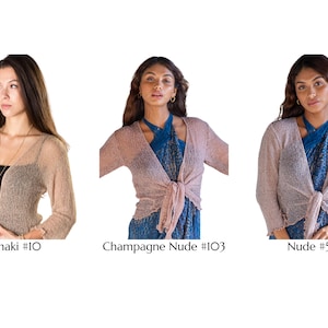 May include: Three open-front shrugs with three-quarter length sleeves and textured fabric. The left shrug is khaki #10, the center is champagne nude #103, and the right is nude #56. Each garment features a lightweight, semi-sheer knit construction.