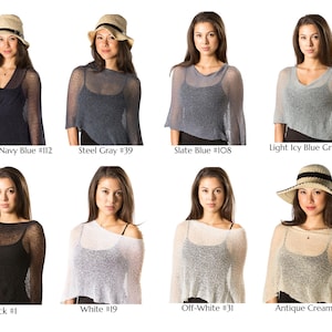 May include: A collection of eight sheer, lightweight knit ponchos in various colours including Midnight Navy Blue #112, Steel Gray #39, Slate Blue #108, Light Icy Blue Grey #18, Black #1, White #19, Off-White #31, and Antique Cream #36, worn over dark tops.