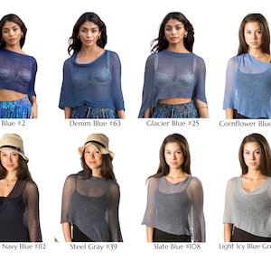 May include: A collection of eight sheer, lightweight knit ponchos in various shades of blue and gray, labeled as Navy Blue #2, Denim Blue #63, Glacier Blue #25, Cornflower Blue #33, Midnight Navy Blue #112, Steel Gray #39, Slate Blue #108, and Light Icy Blue Grey #18.