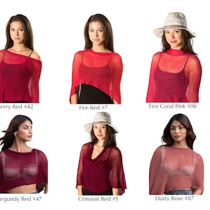 May include: A collection of six lightweight, semi-sheer knit ponchos in various shades of red and pink, labeled as Cherry Red #42, Fire Red #7, Fire Coral Pink #116, Burgundy Red #47, Crimson Red #5, and Dusty Rose #117, worn over dark tops.