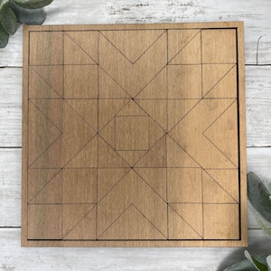 May include: A wooden geometric puzzle with a square frame and a geometric pattern of triangles and squares. The puzzle is made of light brown wood and has a natural wood finish.
