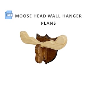 May include: Wooden moose head wall hanger plans. The plans are for a brown and light wood moose head with antlers. The plans are in PDF format.
