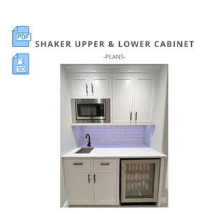 May include: White shaker style upper and lower kitchen cabinets with black hardware. The cabinets are installed above a white countertop with a stainless steel sink and faucet. A small stainless steel refrigerator is to the right of the sink. The cabinets are labeled "Shaker Upper & Lower Cabinet -Plans-"
