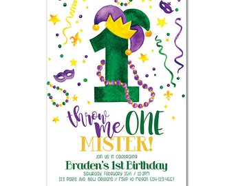 May include: A green and purple Mardi Gras themed invitation for a first birthday party. The invitation features a large number one with a jester's hat and beads. The text reads "Throw Me One Mister! Braden's 1st Birthday Saturday, February 15th / 12-2pm 123 Paris Ave, New Orleans / RSVP to Megan 504-123-4567"