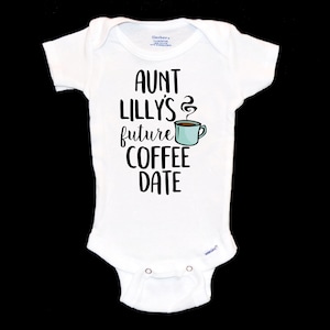 May include: White baby onesie with black text that reads "Aunt Lilly's future coffee date" and a cartoon image of a coffee cup with steam.
