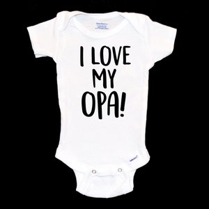 May include: White baby onesie with black text that reads "I LOVE MY OPA!"