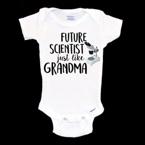 May include: White baby onesie with black text that reads "Future Scientist just like Grandma" and a small illustration of a microscope.