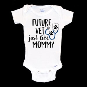 May include: White baby onesie with black text that reads "FUTURE VET just like MOMMY" and a blue stethoscope with paw prints.
