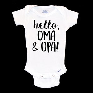 May include: White baby onesie with black text that reads "hello, oma & opa!"
