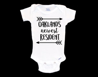 Oakland California Pregnancy Announcement. Baby Onesie®. We're Pregnant.  I'm Expecting. Onesie®. Newest Resident. Population +1. Cali Baby.