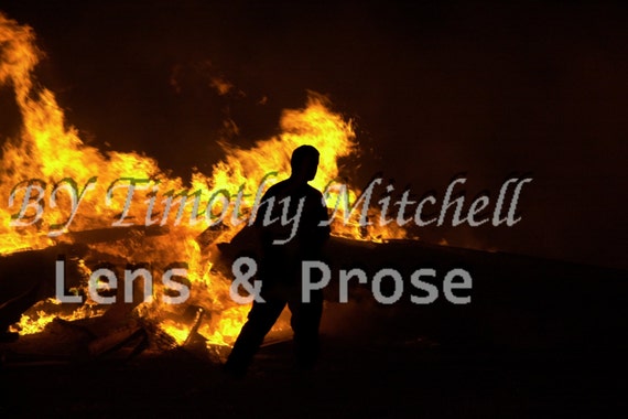 Man Silhouette in fire by Timothy Mitchell