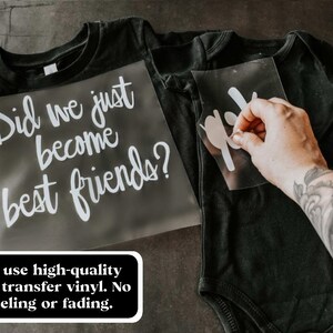 May include: Two black t-shirts with white vinyl heat transfer designs. The larger shirt says "Did we just become best friends?" and the smaller shirt has a simple design. The text "We use high-quality heat transfer vinyl. No peeling or fading." is visible below the shirts.