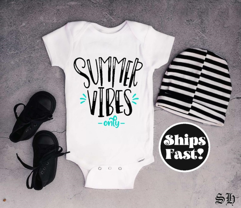 May include: White baby onesie with black text that says "Summer Vibes -only-" in a playful font. The text is accented with a turquoise blue design.