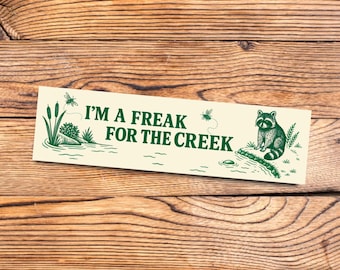Funny bumper sticker for nature lovers with vintage vibes featuring a cute raccoon outdoorsy cottagecore aesthetic for creek forest fans