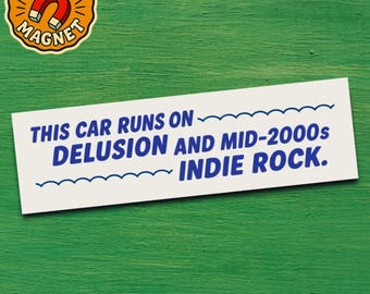 May include: A white bumper sticker with the text "THIS CAR RUNS ON DELUSION AND MID-2000s INDIE ROCK" in blue. A circular magnet with a red horseshoe magnet and the words "BUMPER MAGNET" is in the upper left corner. The background is green.