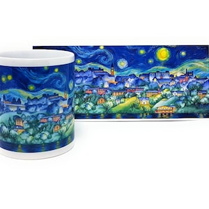 May include: A white ceramic mug with a colorful image of a town at night with a starry sky. The image is reminiscent of Vincent van Gogh's "Starry Night" painting.