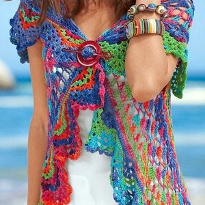 May include: A colourful crochet top with a scalloped hem and short sleeves. The top is made with a variety of bright colours, including pink, blue, green, and orange.