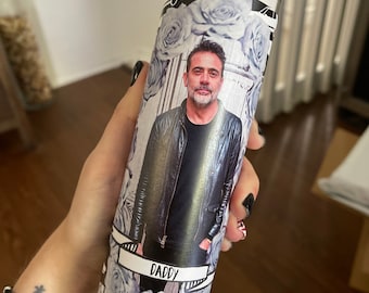 May include: A white candle with a black and white label featuring a man's portrait and the word "Daddy". The label also has a floral design with blue roses.