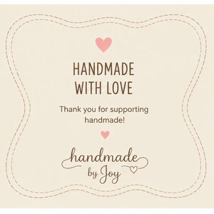 May include: A cream-coloured square card with a decorative stitched border. The text "HANDMADE WITH LOVE" is in brown, with a pink heart above and below. The text "Thank you for supporting handmade!" is also included, along with "handmade by Joy".