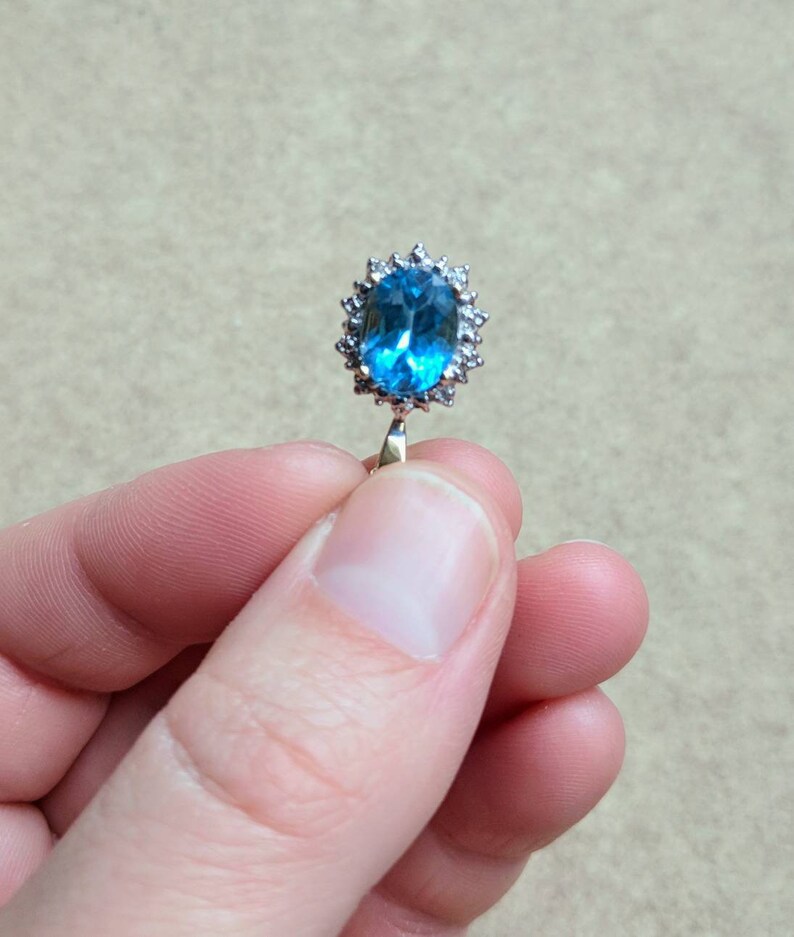 10k gold blue topaz and diamond halo necklace yellow gold genuine diamond halo oval shaped faceted topaz November birthstone