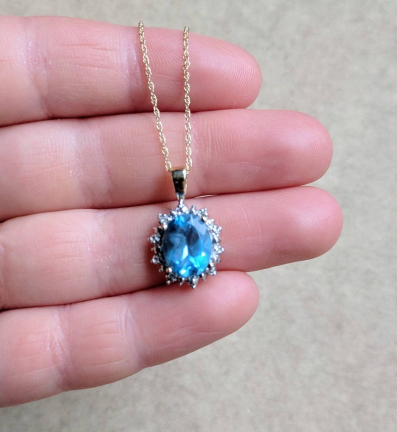 10k gold blue topaz and diamond halo necklace yellow gold genuine diamond halo oval shaped faceted topaz November birthstone