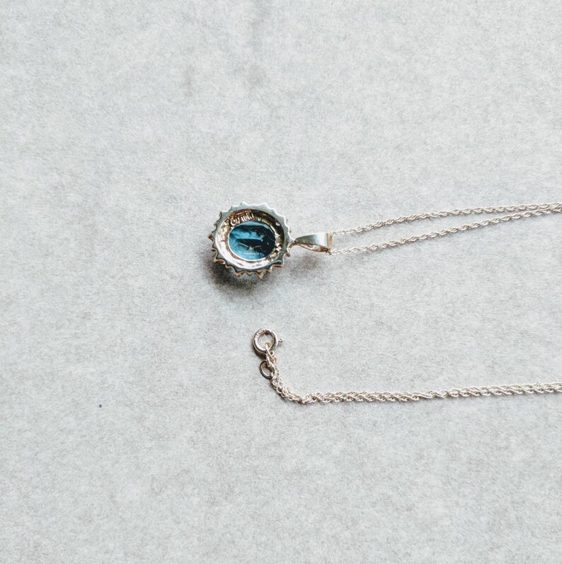 10k gold blue topaz and diamond halo necklace yellow gold genuine diamond halo oval shaped faceted topaz November birthstone