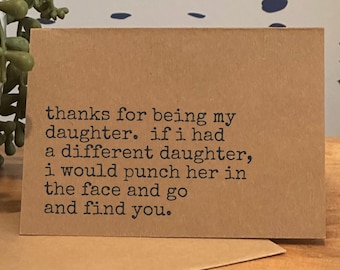 May include: A kraft paper greeting card with black text that reads: "thanks for being my daughter. if i had a different daughter, i would punch her in the face and go and find you."