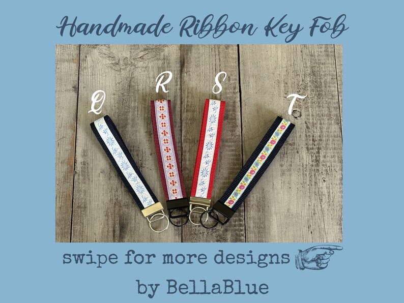 May include: Handmade ribbon key fobs in navy, burgundy, and red with floral and geometric patterns. Each fob has a metal ring and the letters Q, R, S, and T are visible. The text "swipe for more designs" and "by BellaBlue" are also present.