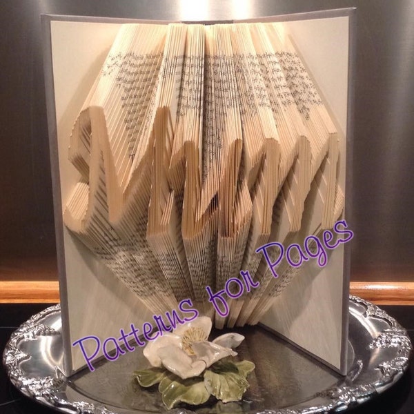 Book folding pattern for the word MUM
