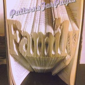 Book folding pattern for FAMILY with a heart in place of the dot