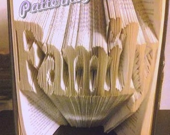 Book folding pattern for FAMILY with a heart in place of the dot
